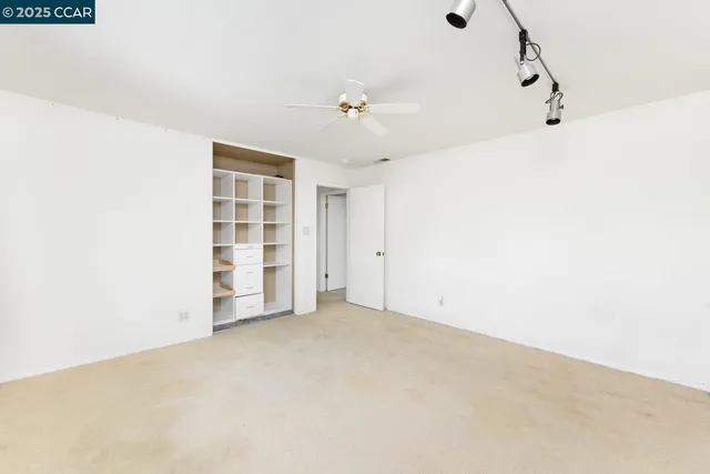 a en suite bathroom with a sink mirror and shower