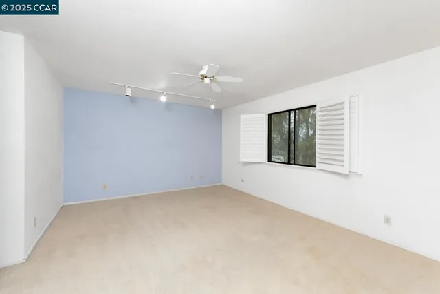 a spacious bathroom with a sink a toilet and mirror