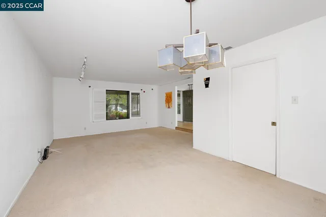 a view of a white house with windows