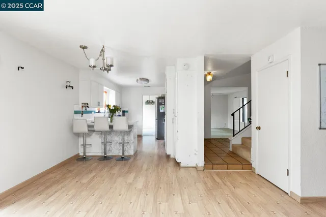 a view of a living room and a wooden floor