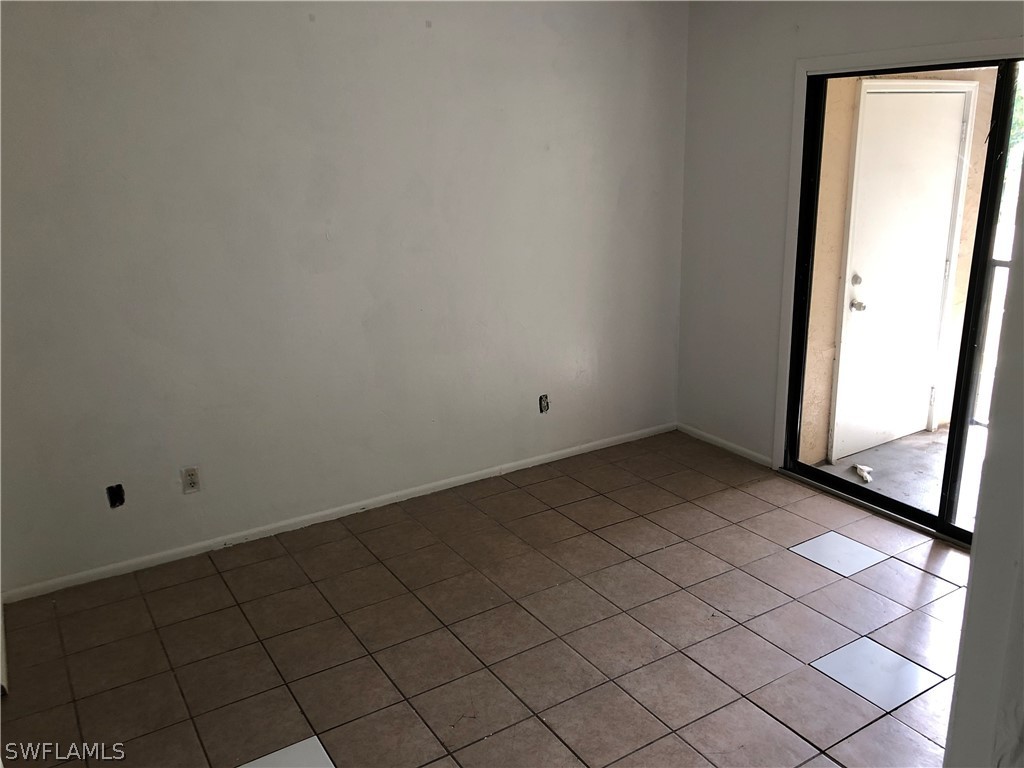 824 Alderman Street, Unit 209 Fort Myers, FL 33916 - Photo 3 of 7 an empty room with windows
