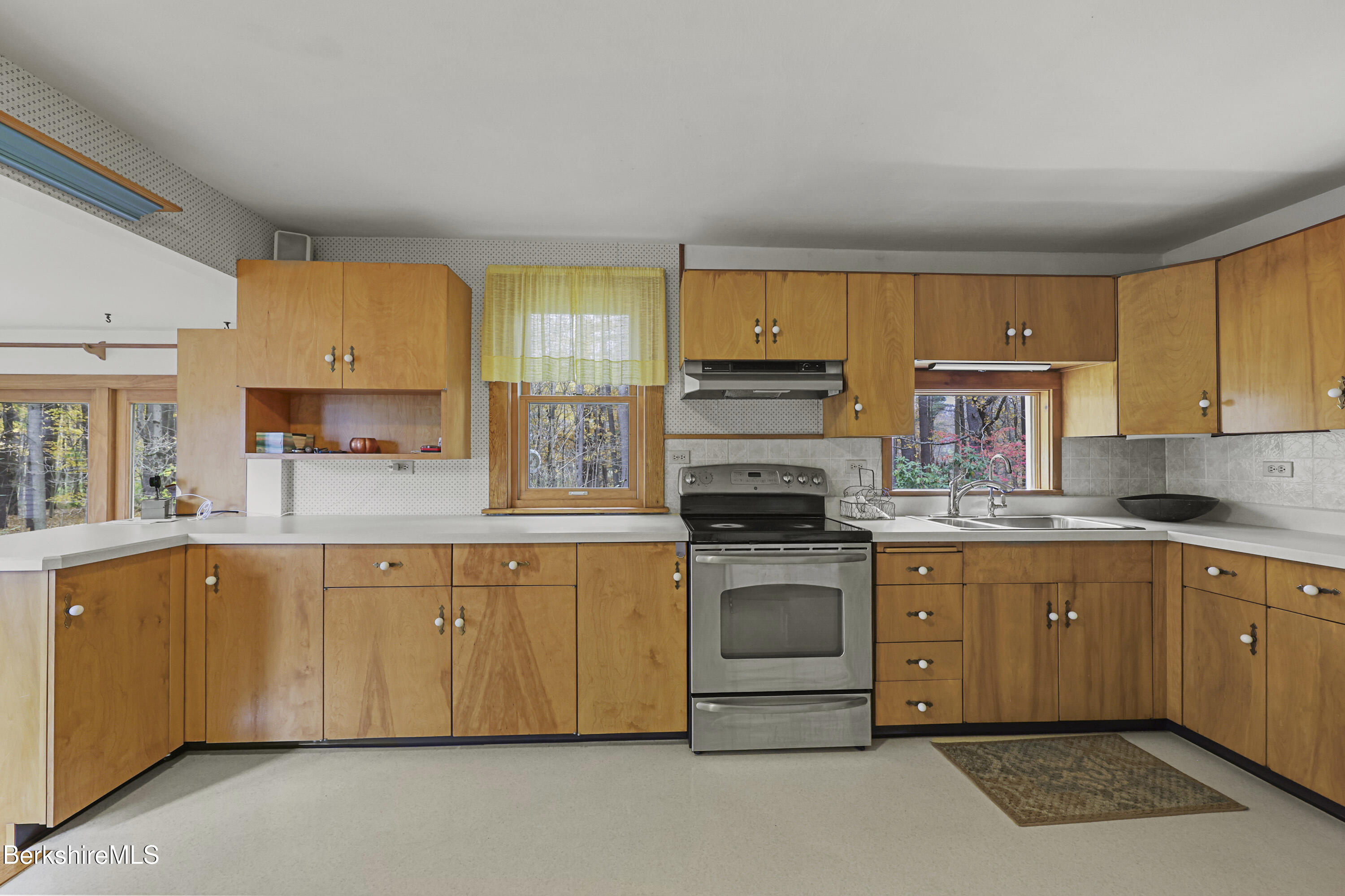 1772 Swamp Road Richmond, MA 01254 - Photo 14 of 62 a kitchen with stainless steel appliances granite countertop a stove sink and cabinets