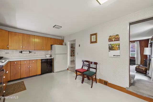 a view of livingroom with furniture and large window