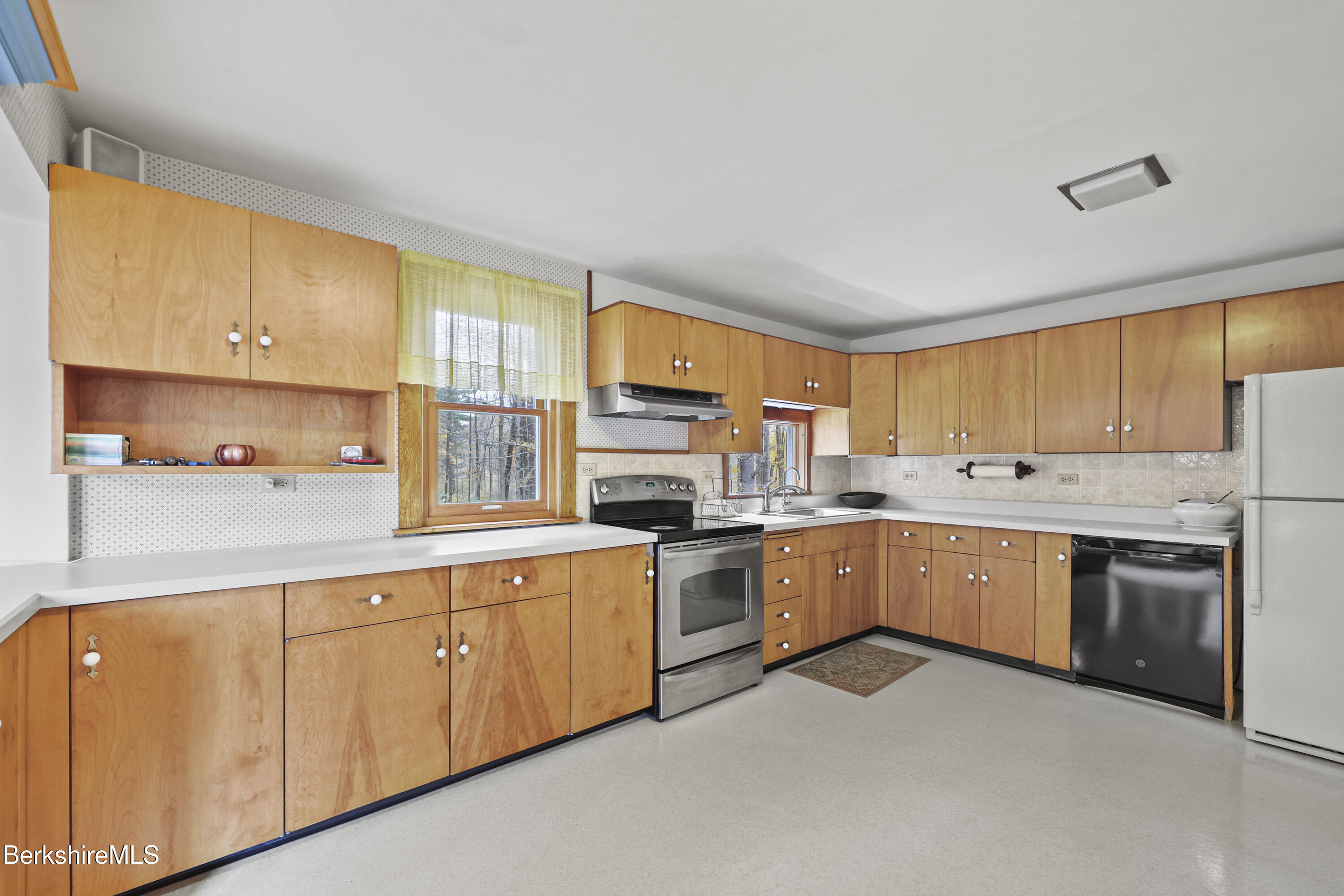1772 Swamp Road Richmond, MA 01254 - Photo 18 of 62 a kitchen with stove a sink and white cabinets