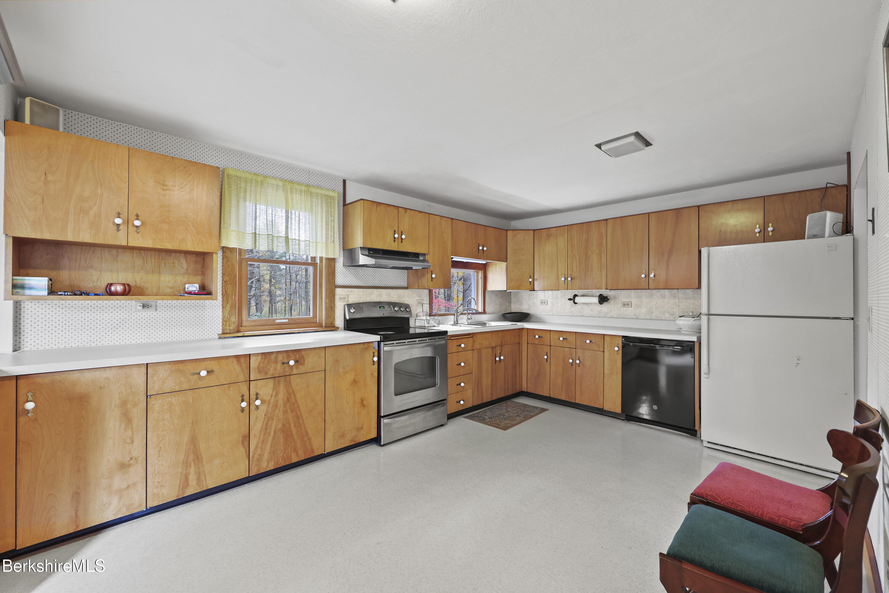 1772 Swamp Road Richmond, MA 01254 - Photo 19 of 62 a kitchen with a sink refrigerator and cabinets