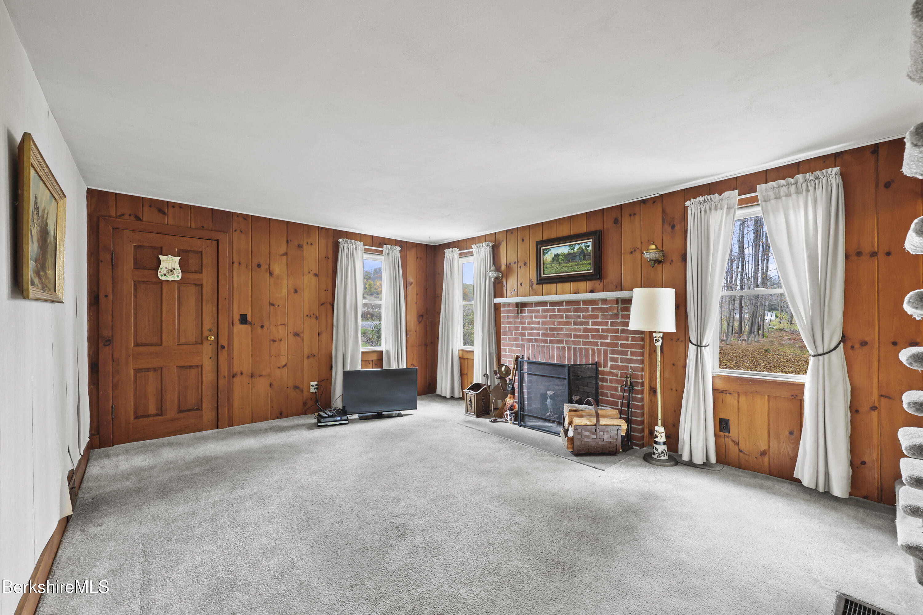 1772 Swamp Road Richmond, MA 01254 - Photo 30 of 62 an empty room with fireplace and window