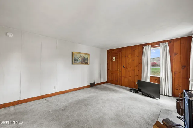 a bedroom with a bed and a fireplace