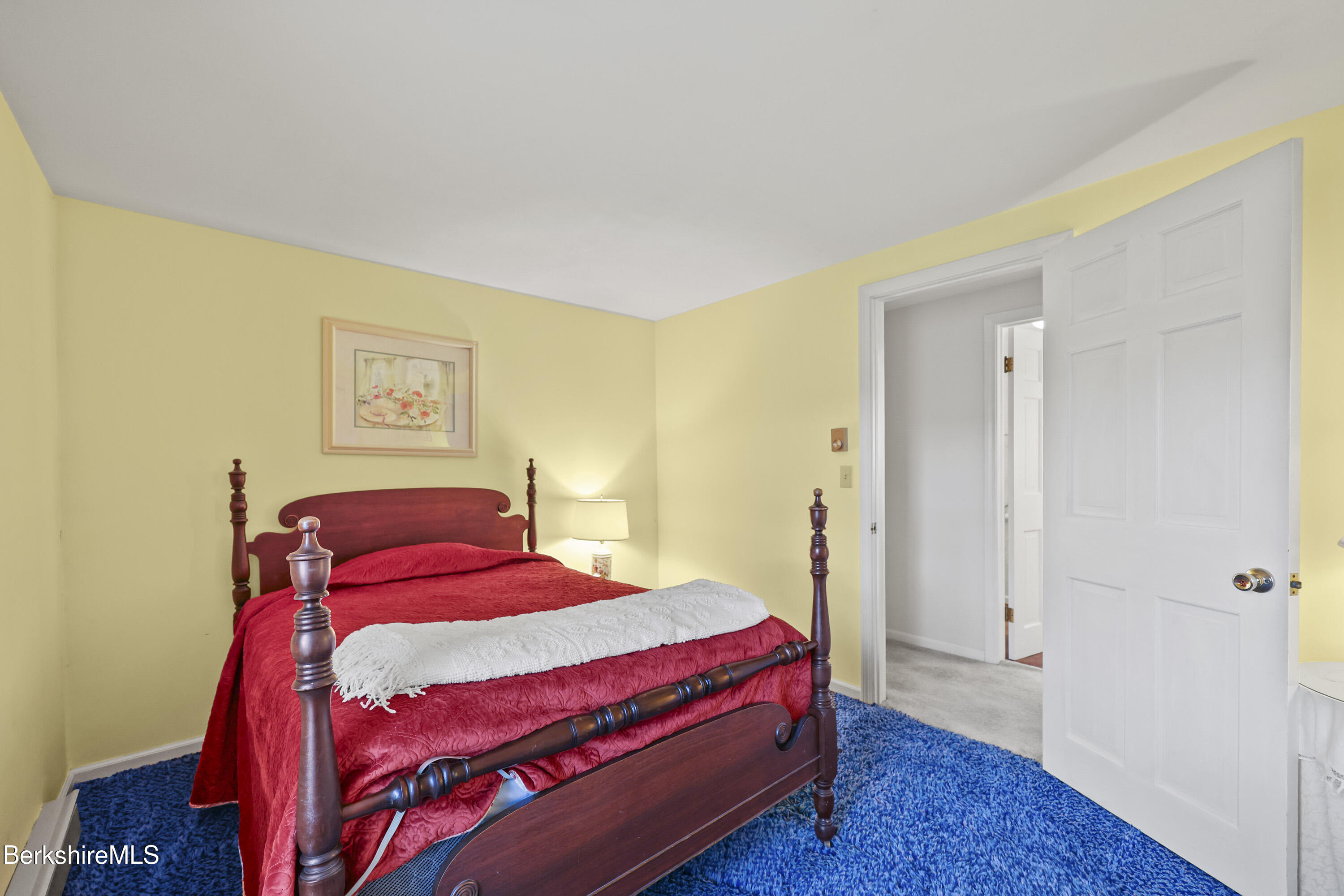 1772 Swamp Road Richmond, MA 01254 - Photo 45 of 62 a bedroom with a bed and a painting on the wall
