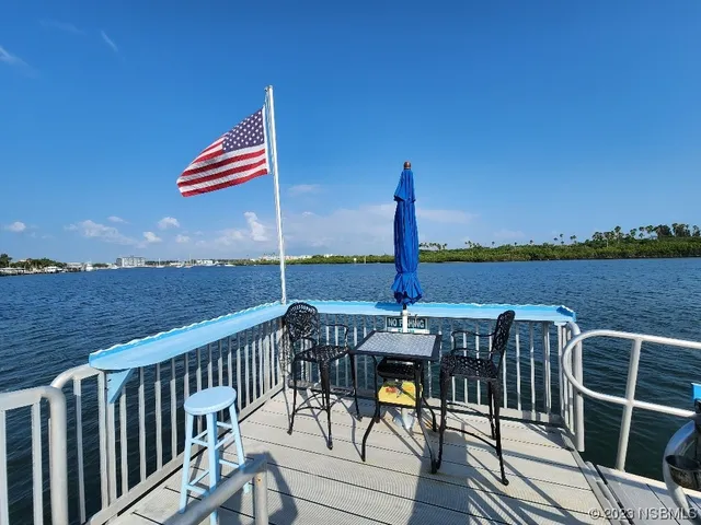 a view of a balcony with chairs
