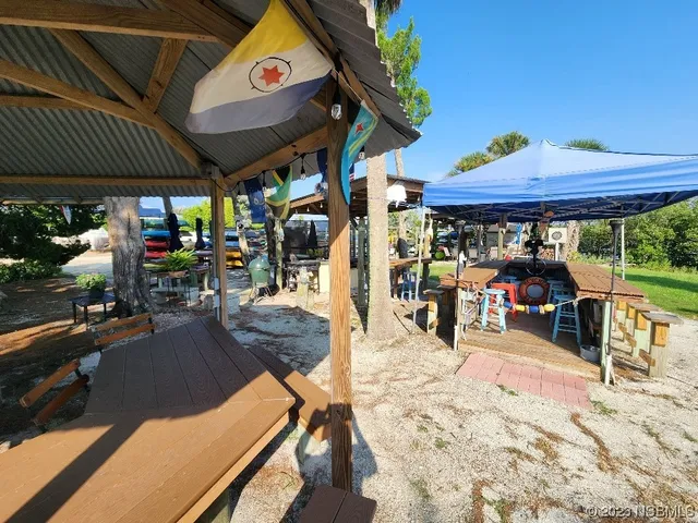 a view of a chairs and table in the patio