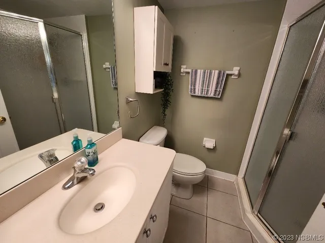 a bathroom with a sink a toilet and vanity