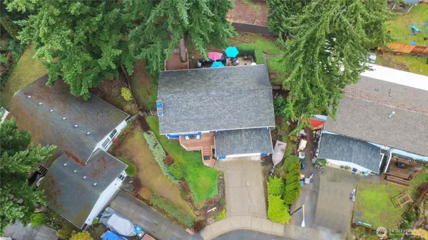 an aerial view of a house with a yard