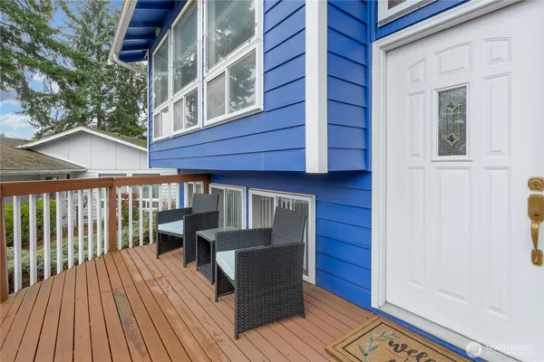 a view of a two chairs in the balcony