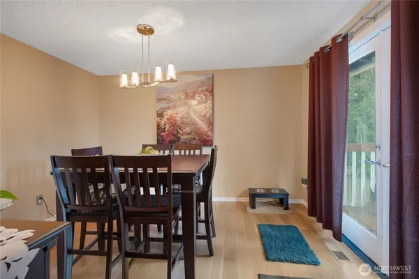 a view of a dining room with furniture window and outside view