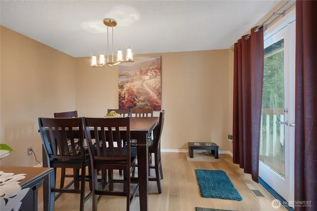a view of a dining room with furniture window and outside view