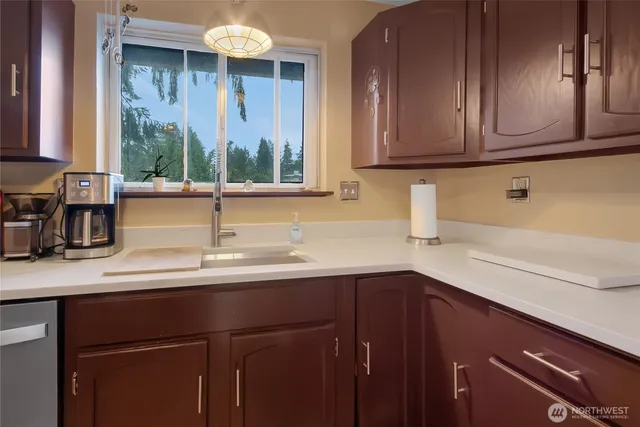 a kitchen with a sink and cabinets