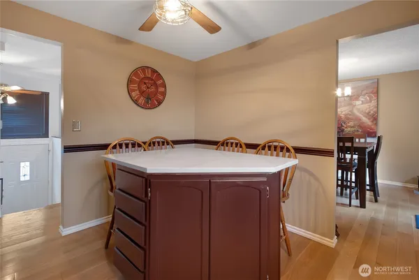 a view of a kitchen with stainless steel appliances granite countertop a sink and a stove