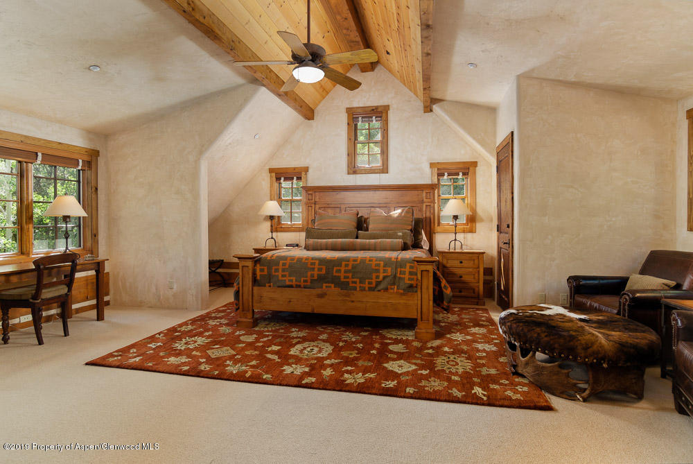 43 Altamira Ranch Road Basalt, CO 81621 - Photo 13 of 29 a bedroom with furniture and a window