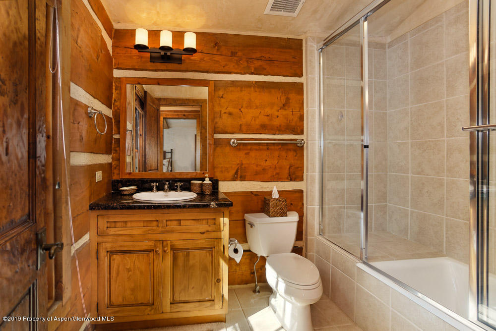 43 Altamira Ranch Road Basalt, CO 81621 - Photo 16 of 29 a bathroom with a granite countertop sink toilet and shower