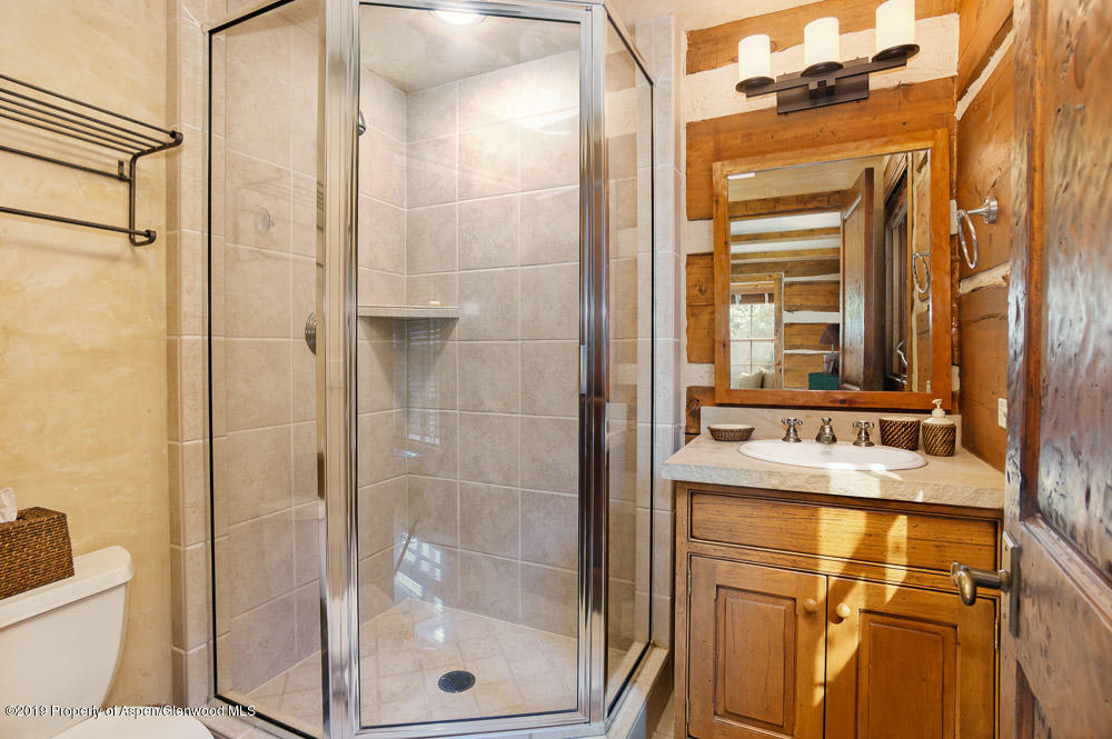 43 Altamira Ranch Road Basalt, CO 81621 - Photo 18 of 29 a bathroom with a bathtub shower sink mirror and toilet
