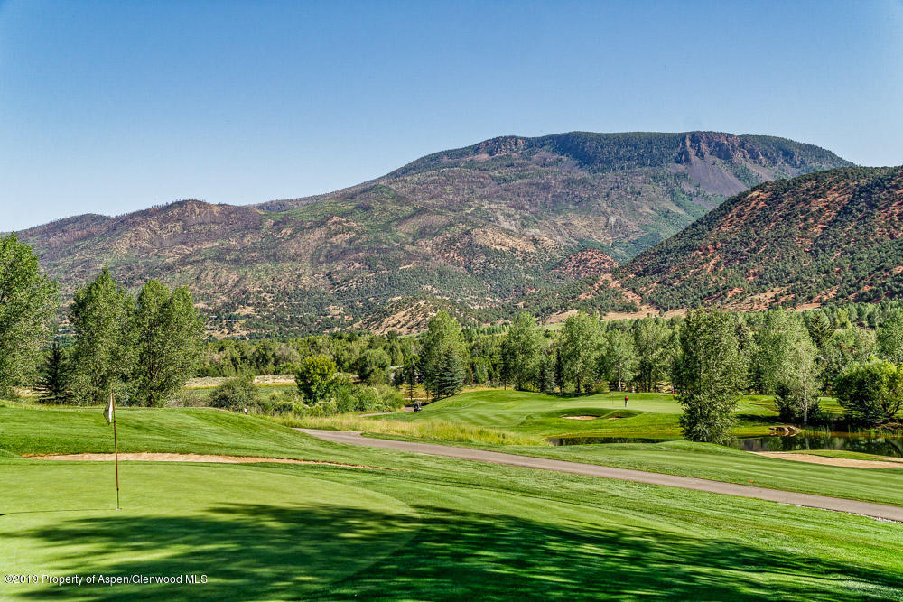 43 Altamira Ranch Road Basalt, CO 81621 - Photo 29 of 29 a view of a grassy field with a mountain