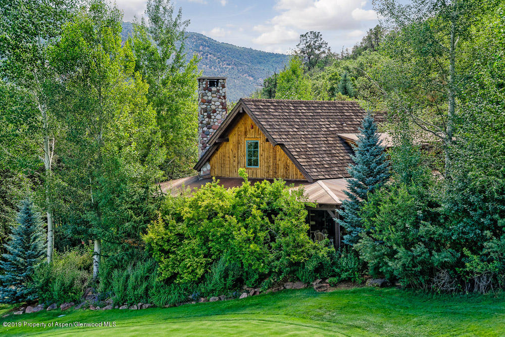 43 Altamira Ranch Road Basalt, CO 81621 - Photo 3 of 29 a view of a garden with a house in the background