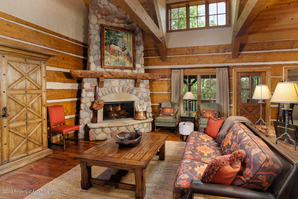43 Altamira Ranch Road Basalt, CO 81621 - Photo 6 of 29 a living room with furniture a fireplace and a table