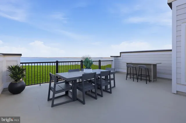 a patio with table and chairs