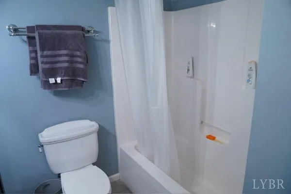 a bathroom with a toilet a sink and bathtub