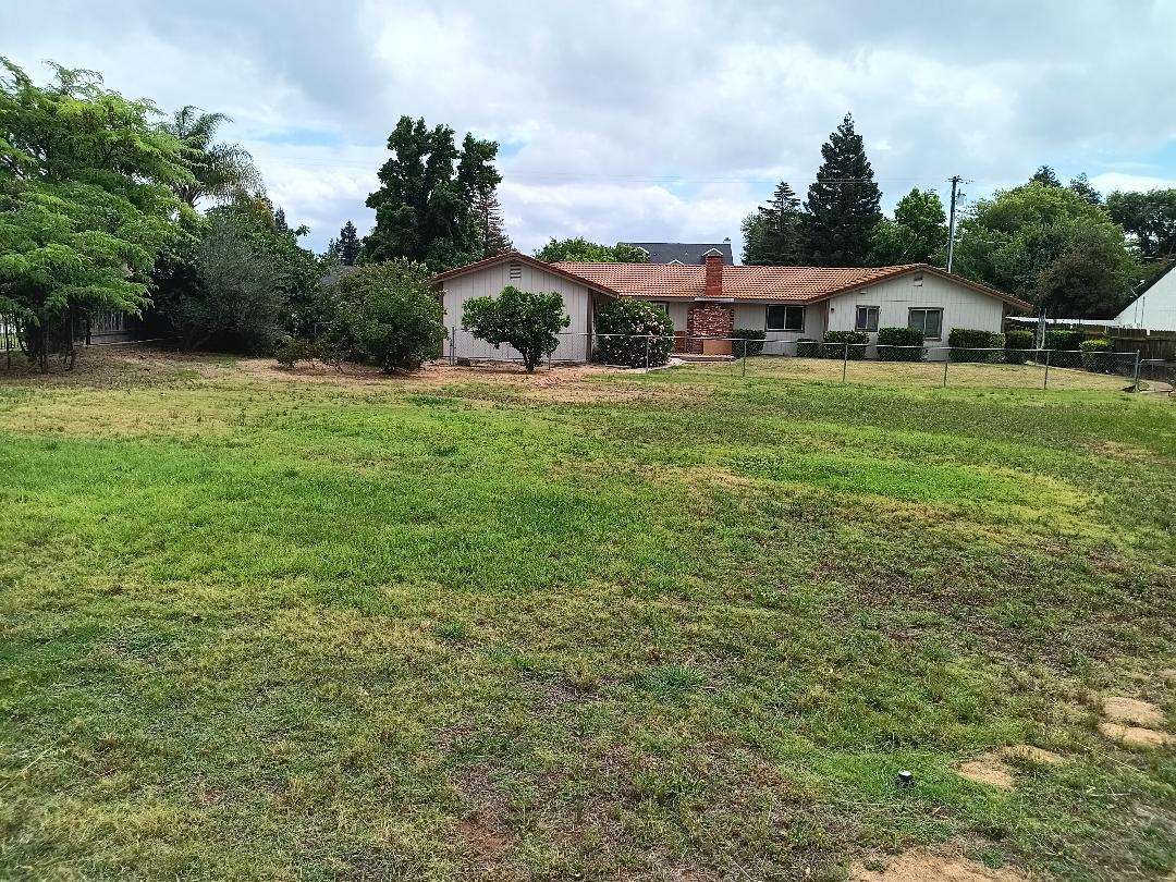 19324 Farallon Road Madera, CA 93638 - Photo 2 of 10 a aerial view of house with yard and car parked