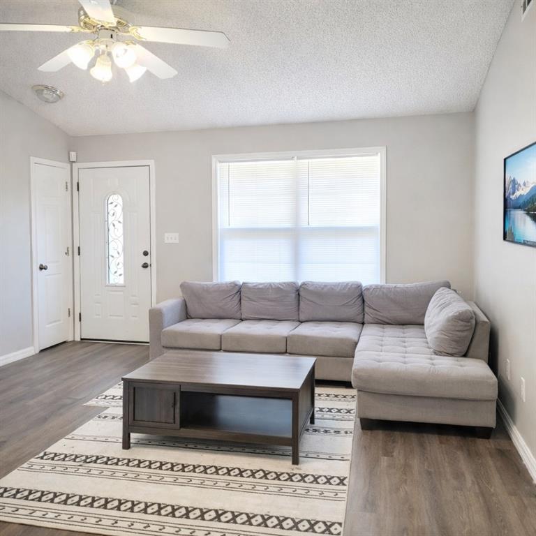 a living room with furniture and a window