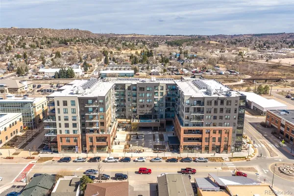 an aerial view of residential houses and city view