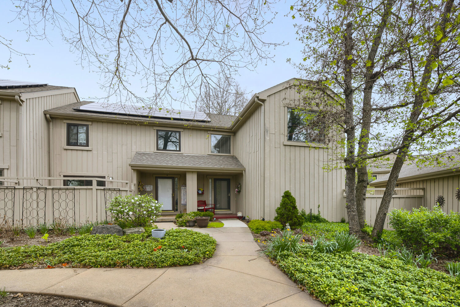 a front view of a house with garden