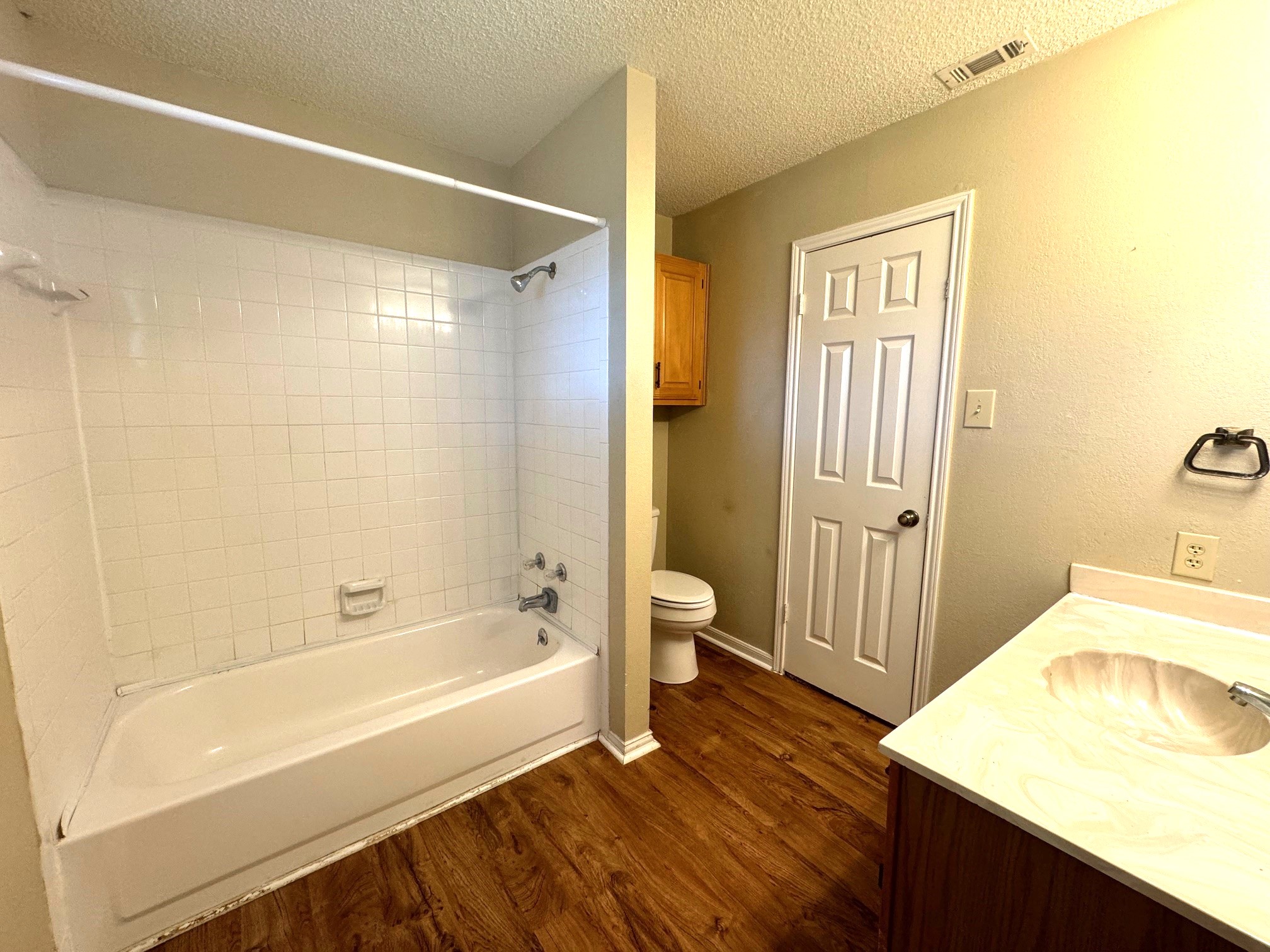 117 Quail Cove, Unit A Lockhart, TX 78644 - Photo 11 of 12 a bathroom with a bathtub and a sink