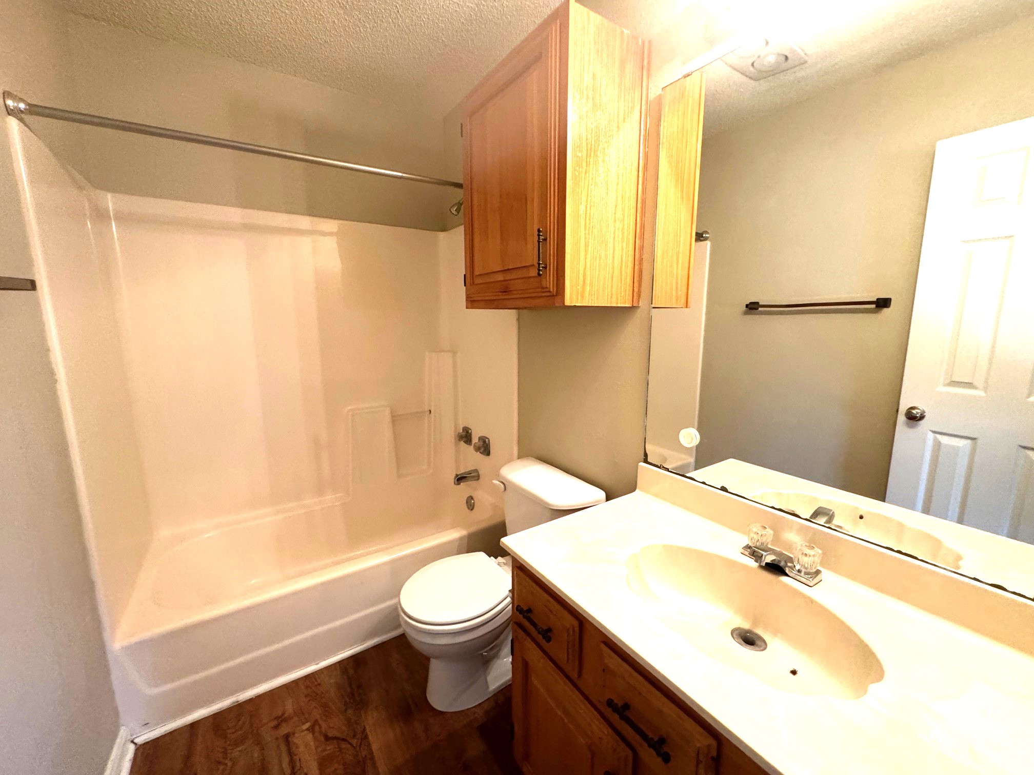 117 Quail Cove, Unit A Lockhart, TX 78644 - Photo 3 of 12 a bathroom with a sink a toilet and shower