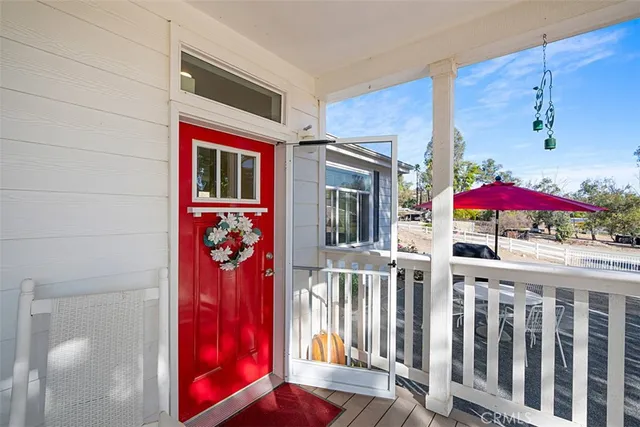 a view of a house with a balcony and window