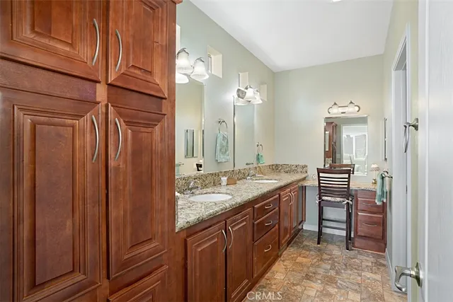 a bathroom with a sink double vanity and a mirror