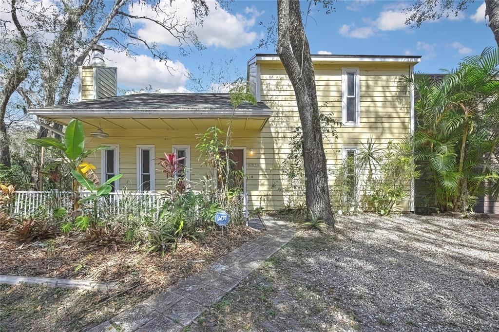 a view of front door and small yard