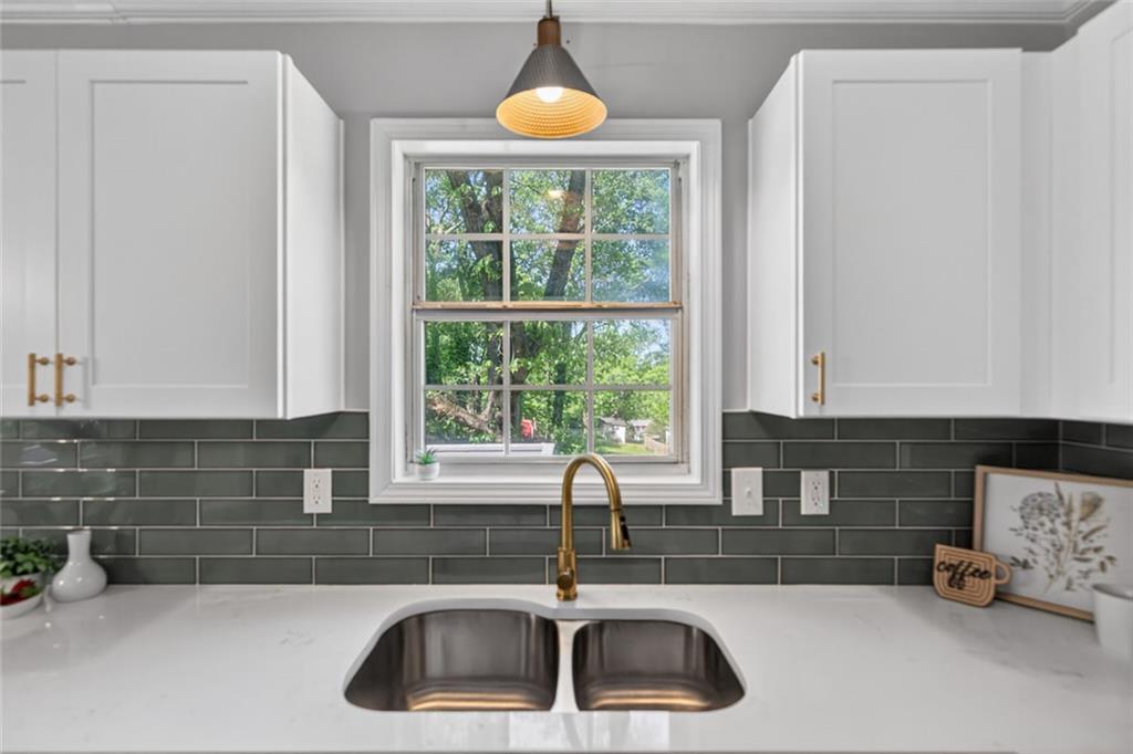 190 Killian Street Canton, GA 30114 - Photo 14 of 44 a kitchen with a sink and a window