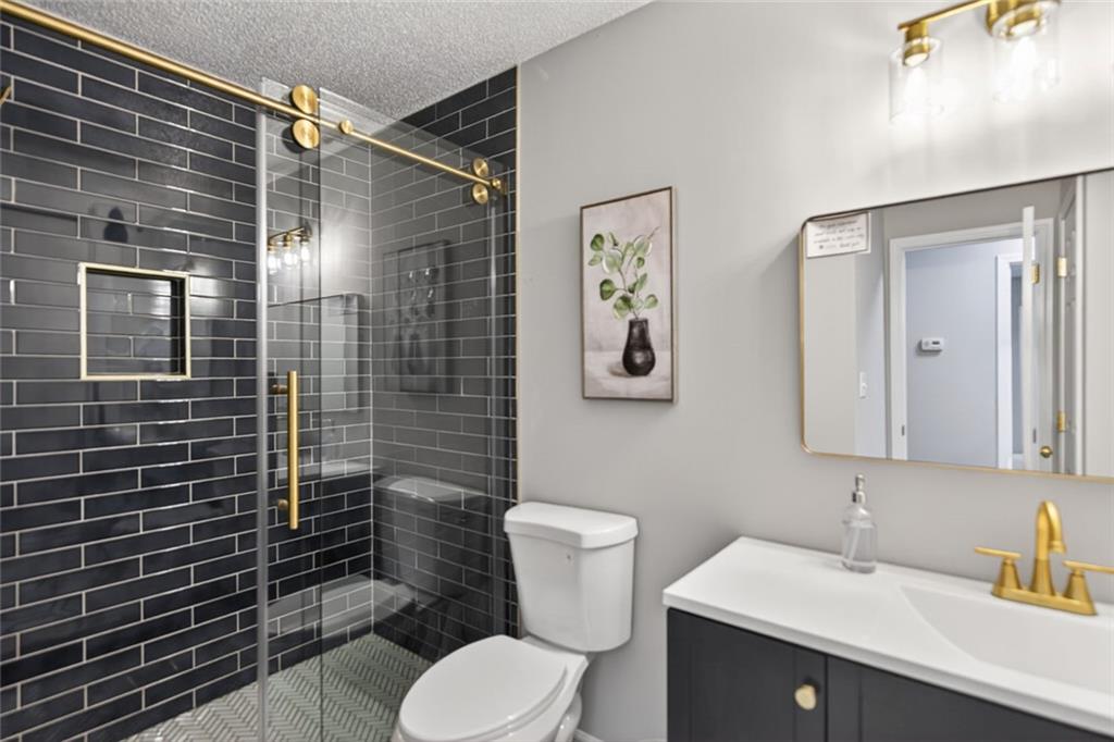190 Killian Street Canton, GA 30114 - Photo 17 of 44 a bathroom with a sink toilet and shower