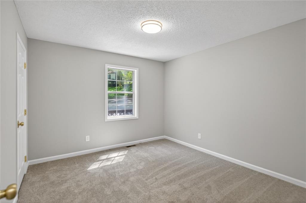 190 Killian Street Canton, GA 30114 - Photo 19 of 44 an empty room with a window