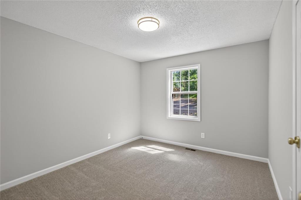 190 Killian Street Canton, GA 30114 - Photo 20 of 44 an empty room with a window