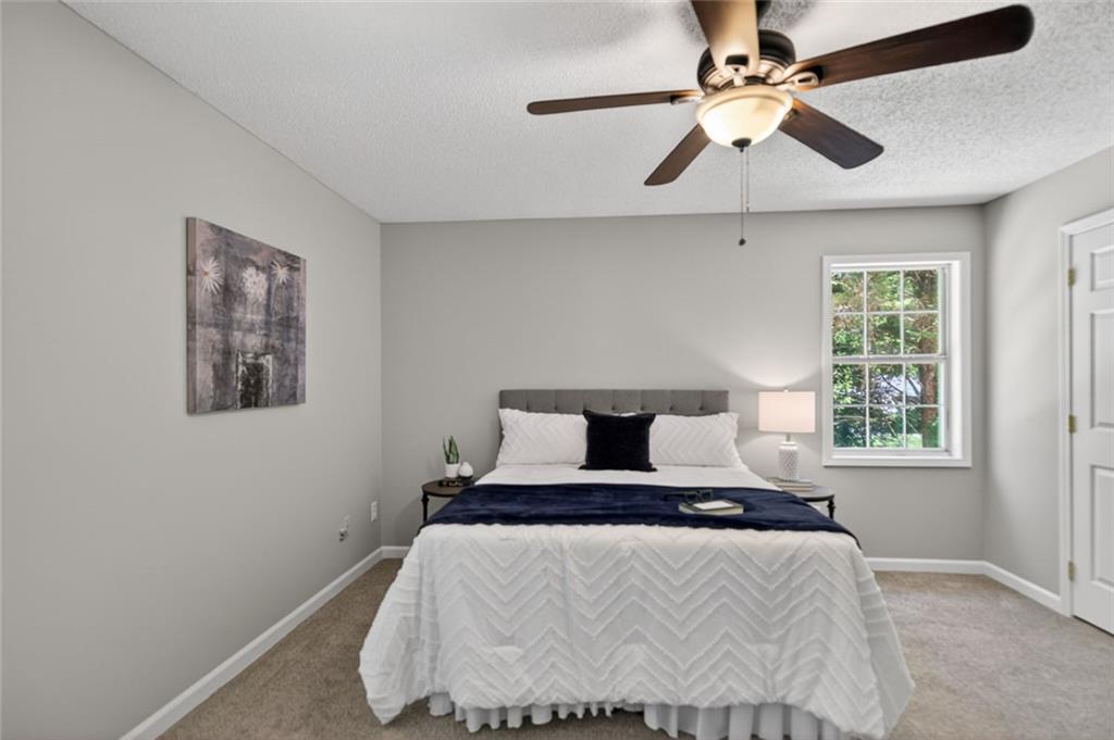 190 Killian Street Canton, GA 30114 - Photo 22 of 44 a bedroom with a bed and a window