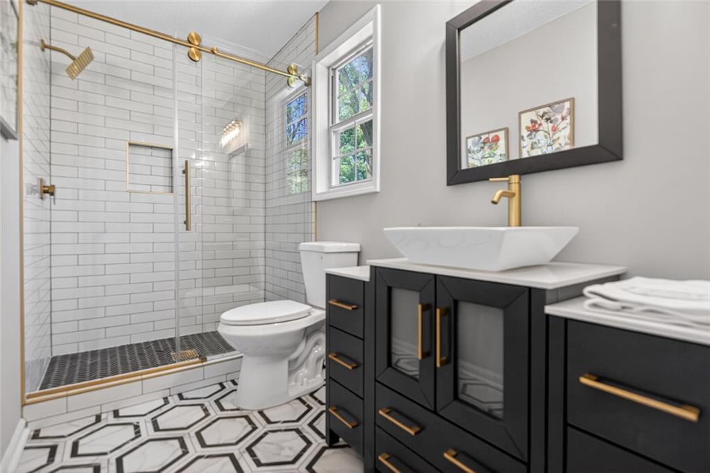 190 Killian Street Canton, GA 30114 - Photo 25 of 44 a bathroom with a sink toilet and shower