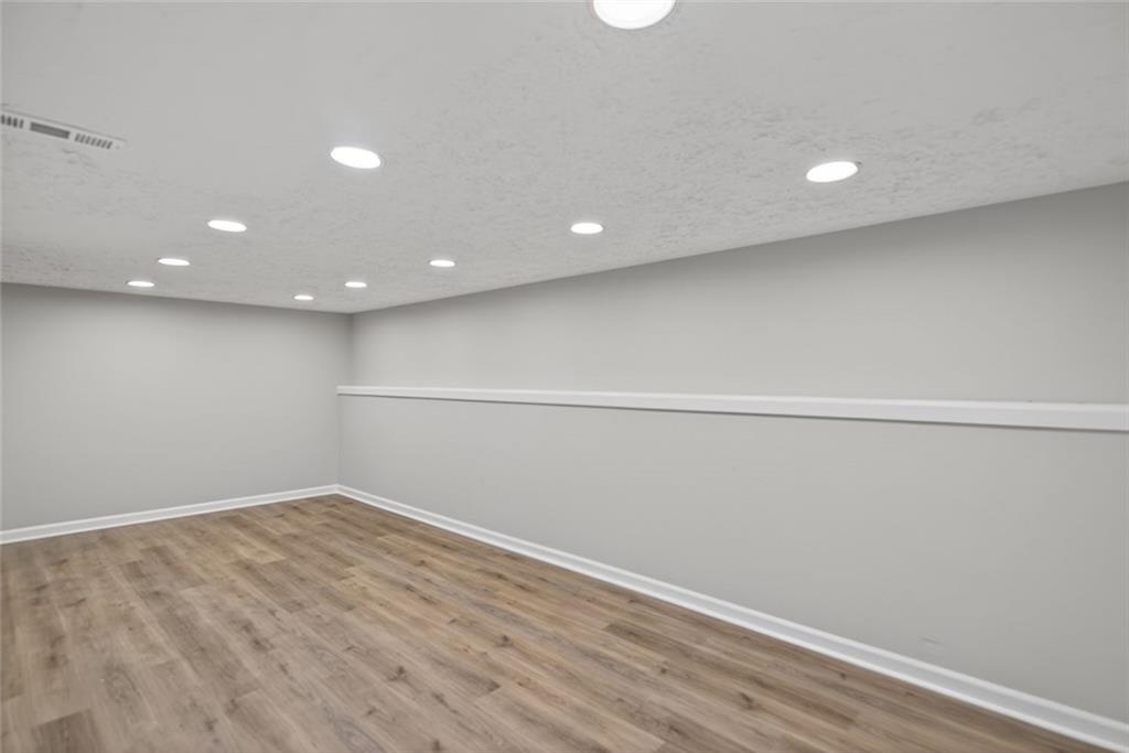 190 Killian Street Canton, GA 30114 - Photo 27 of 44 a view of room with wooden floor and fan