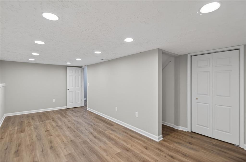 190 Killian Street Canton, GA 30114 - Photo 28 of 44 a view of an empty room with wooden floor
