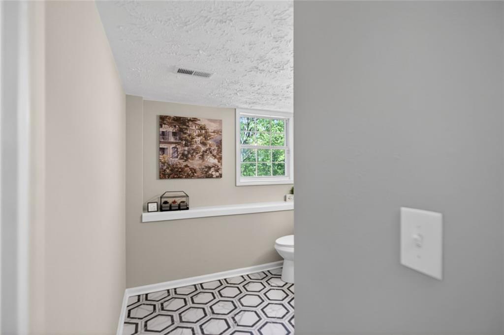 190 Killian Street Canton, GA 30114 - Photo 29 of 44 a bathroom with a bathtub and a shower