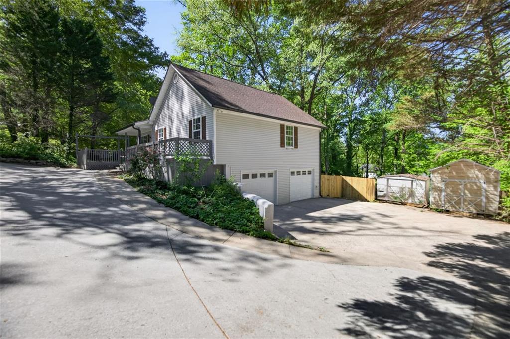 190 Killian Street Canton, GA 30114 - Photo 3 of 44 a white house that has a tree in front of it