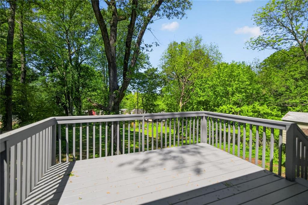 190 Killian Street Canton, GA 30114 - Photo 31 of 44 a balcony with wooden floor and fence