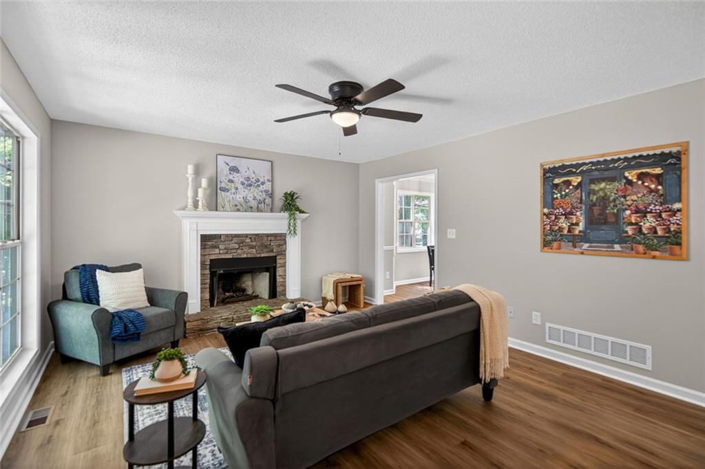 190 Killian Street Canton, GA 30114 - Photo 7 of 44 a living room with furniture and a fireplace
